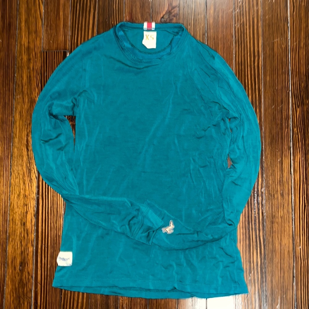 Tracksmith green tencel/merino blend harrier top